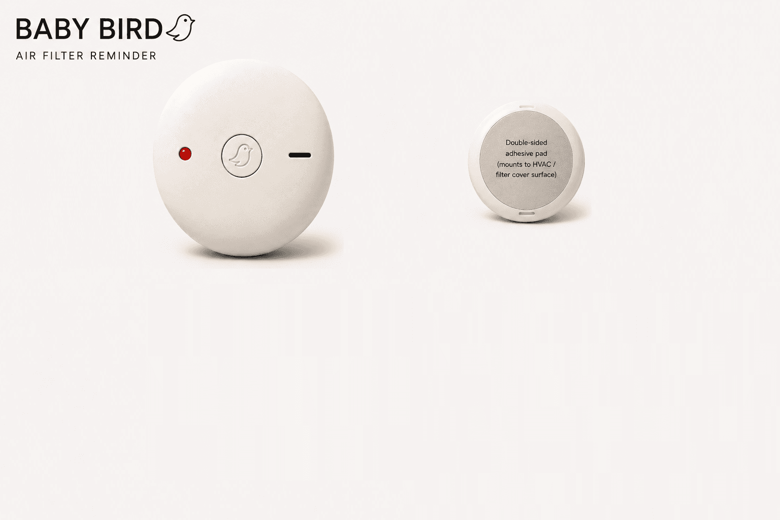Baby Bird physical home air filter change reminder showing its red indicator light, center reset button, and sound slot